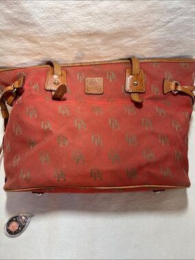 Dooney & Bourke Brick Red Logo Tote with Tan Leather Trim.